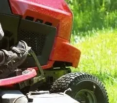 Red riding lawn mower