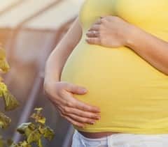 Pregnant Woman Holding Belly